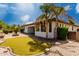 Backyard putting green with lush landscaping and desert landscaping at 702 E Capricorn Way, Chandler, AZ 85249