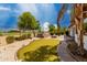 Backyard putting green with lush landscaping and golf course views at 702 E Capricorn Way, Chandler, AZ 85249