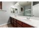 Spacious bathroom with a double sink vanity and a large mirror and tiled floors at 702 E Capricorn Way, Chandler, AZ 85249