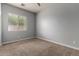 Neutral carpeted bedroom with large window and natural light and neutral paint at 702 E Capricorn Way, Chandler, AZ 85249
