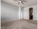 The bedroom has neutral walls, carpet, and a ceiling fan at 702 E Capricorn Way, Chandler, AZ 85249