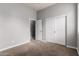 Bedroom features neutral carpet and closet with white sliding doors at 702 E Capricorn Way, Chandler, AZ 85249