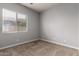 Bedroom features neutral carpet, window with blinds and neutral paint at 702 E Capricorn Way, Chandler, AZ 85249