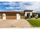 Charming single-story home with a spacious three-car garage and well-manicured landscaping at 702 E Capricorn Way, Chandler, AZ 85249