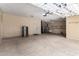 Spacious three car garage with side refrigerator and plenty of storage space at 702 E Capricorn Way, Chandler, AZ 85249