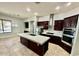 A spacious kitchen with a large island and updated, stainless steel appliances and plenty of storage space at 702 E Capricorn Way, Chandler, AZ 85249