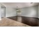 A spacious living room has tile and hardwood floors, and a view of the front yard at 702 E Capricorn Way, Chandler, AZ 85249