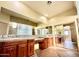 The bathroom has a large double vanity, with a glass-blocked shower area and updated fixtures and mirrors at 702 E Capricorn Way, Chandler, AZ 85249