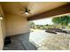 Covered patio with stamped concrete and a peaceful backyard view at 702 E Capricorn Way, Chandler, AZ 85249