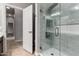 Contemporary glass-enclosed shower with sleek hardware and modern tile detail at 702 E Capricorn Way, Chandler, AZ 85249