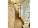 The updated bathroom features a glass-block shower with dual shower heads and tile throughout at 702 E Capricorn Way, Chandler, AZ 85249