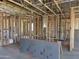 Exposed beams and newly installed insulation inside new construction home at 7700 W Saddlehorn Rd, Peoria, AZ 85383