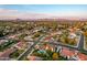 Extensive aerial perspective of a suburban neighborhood, featuring lush backyard pools and beautifully landscaped homes at 908 N Creston --, Mesa, AZ 85213