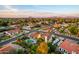 Aerial view showcases a private pool and a residence with well-kept landscaping at the corner of a tranquil neighborhood at 908 N Creston --, Mesa, AZ 85213