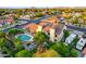 Backyard aerial view of home with swimming pool, patio, mature trees, and playground equipment at 908 N Creston --, Mesa, AZ 85213