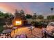 Backyard featuring a charming brick fireplace, a brick patio and comfortable seating at 908 N Creston --, Mesa, AZ 85213