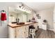 Charming bathroom vanity featuring double sinks, granite counters, and decorative cabinetry at 908 N Creston --, Mesa, AZ 85213