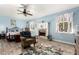 Cozy bedroom with a ceiling fan, fireplace, and natural light coming through the windows at 908 N Creston --, Mesa, AZ 85213