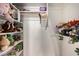 Walk-in closet featuring built-in shelving for storage of clothes, books, and stuffed animals at 908 N Creston --, Mesa, AZ 85213