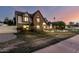 Elegant brick Tudor-style home with a landscaped lawn and inviting arched entryway at 908 N Creston --, Mesa, AZ 85213