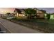 Charming Tudor-style home with lush front yard and mature landscaping at 908 N Creston --, Mesa, AZ 85213