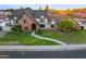 Elegant two-story home with a brick facade, lush landscaping, and a welcoming entrance at 908 N Creston --, Mesa, AZ 85213