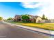 Beautiful brick home with a well-manicured lawn and lush landscaping at 908 N Creston --, Mesa, AZ 85213