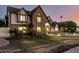 Elegant brick Tudor-style home with a landscaped lawn and inviting arched entryway at 908 N Creston --, Mesa, AZ 85213