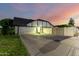 Detached garage with private driveway and lush green lawn at 908 N Creston --, Mesa, AZ 85213