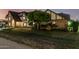 Charming Tudor-style home with lush front yard and mature landscaping at 908 N Creston --, Mesa, AZ 85213