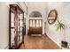 Elegant foyer with a soaring ceiling, wood floors, and decorative mirror at 908 N Creston --, Mesa, AZ 85213