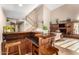 Open layout showcasing living room with fireplace, staircase and adjacent wet bar at 908 N Creston --, Mesa, AZ 85213