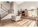 Spacious living room featuring brick fireplace, staircase, high ceilings and ample sunlight at 908 N Creston --, Mesa, AZ 85213