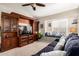 Cozy living room features an entertainment center, plush couch and window seating at 908 N Creston --, Mesa, AZ 85213