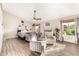 Open-concept living room with a fireplace, vaulted ceilings, and hardwood floors at 908 N Creston --, Mesa, AZ 85213