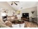 Cozy living room with plush sofas, warm lighting, and entertainment center at 908 N Creston --, Mesa, AZ 85213