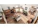 Open living room with fireplace, hardwood floors, high ceilings, and a view to the kitchen and dining area at 908 N Creston --, Mesa, AZ 85213