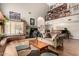 Inviting living room with high ceilings, brick details, bar, and second floor library at 908 N Creston --, Mesa, AZ 85213