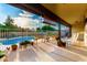 Covered patio overlooking pool, complemented by planters and comfortable seating at 908 N Creston --, Mesa, AZ 85213
