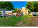 Large backyard with play structure, pizza oven, and room to entertain at 908 N Creston --, Mesa, AZ 85213