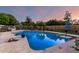 Backyard pool with patio furniture and lush landscaping at 908 N Creston --, Mesa, AZ 85213