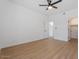 An airy bedroom featuring modern ceiling fan and light-colored wood flooring at 9600 N 96Th St # 216, Scottsdale, AZ 85258