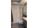 Updated bathroom features modern vanity, cabinet, and plank flooring at 10039 W Lancaster Dr, Sun City, AZ 85351