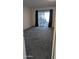 Bedroom has plush carpet, closet, slider to patio, and neutral walls at 10039 W Lancaster Dr, Sun City, AZ 85351