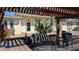 Community space with ramada, desert landscaping, BBQ, and seating at 10039 W Lancaster Dr, Sun City, AZ 85351