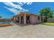 Backyard featuring a covered patio, outdoor seating, and artificial turf putting green at 10583 S 175Th Ave, Goodyear, AZ 85338