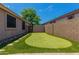 A backyard with artificial turf and a putting green in a low maintenance desert landscape at 10583 S 175Th Ave, Goodyear, AZ 85338