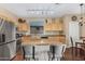 Well-lit kitchen with stainless steel appliances, functional island, and ample counter space at 10583 S 175Th Ave, Goodyear, AZ 85338