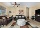 Comfortable living room with stylish decor, ceiling fan, and neutral color palette at 10583 S 175Th Ave, Goodyear, AZ 85338