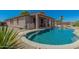 An inground pool with steps and a desert garden, creating a luxurious outdoor retreat at 10583 S 175Th Ave, Goodyear, AZ 85338